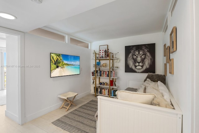 interior space featuring baseboards