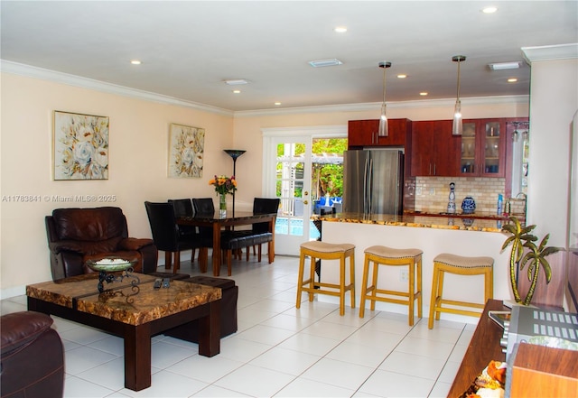 living room with french doors, visible vents, recessed lighting, and ornamental molding