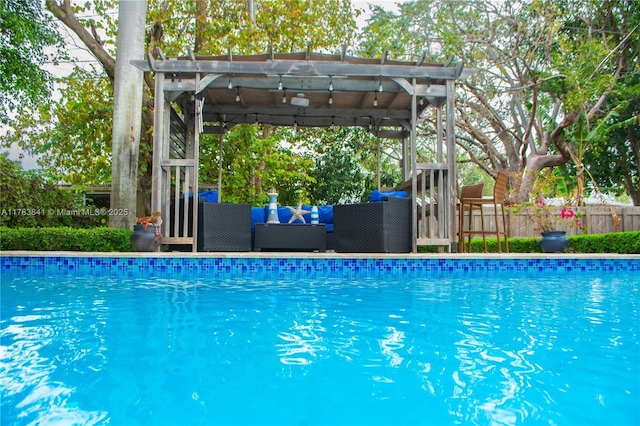 view of pool with fence, outdoor lounge area, and a fenced in pool