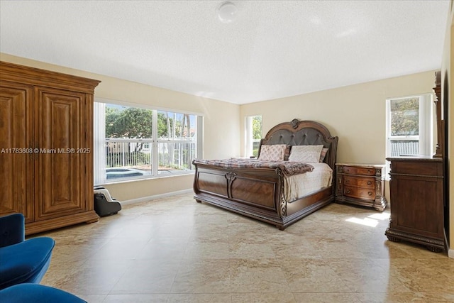 13063 NW 11th Ct, Sunrise, FL 33323 - bedroom featuring baseboards and a textured ceiling