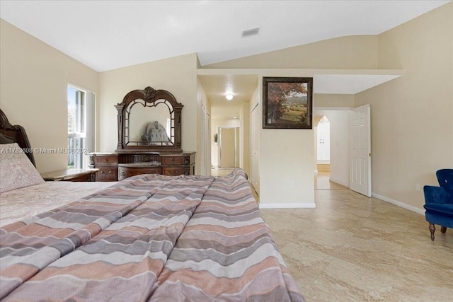 13063 NW 11th Ct, Sunrise, FL 33323 - bedroom with lofted ceiling, baseboards, and arched walkways