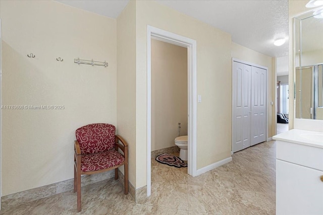 13063 NW 11th Ct, Sunrise, FL 33323 - ensuite bathroom with vanity, toilet, and baseboards