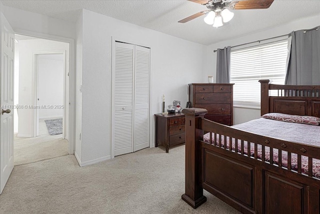 13063 NW 11th Ct, Sunrise, FL 33323 - bedroom with light colored carpet, a closet, a ceiling fan, baseboards, and a textured ceiling