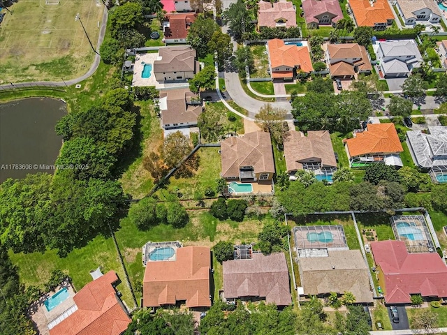 13063 NW 11th Ct, Sunrise, FL 33323 - aerial overview of property's location featuring nearby suburban area, a nearby body of water, and a pool