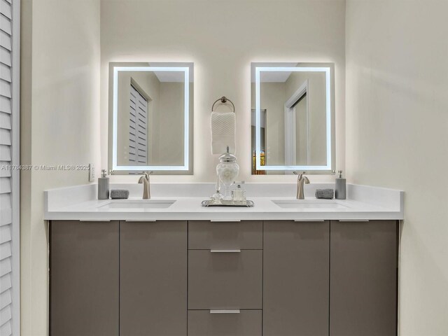 full bathroom featuring a sink and double vanity