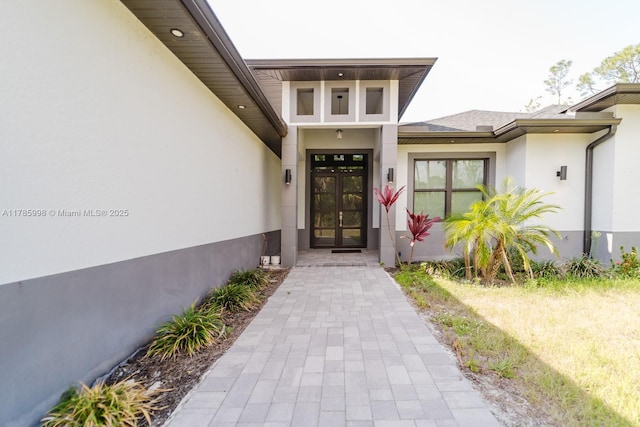 398 35th Ave NW, Naples, FL 34120 - entrance to property with french doors and stucco siding