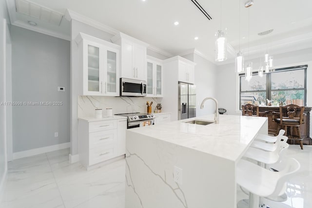 398 35th Ave NW, Naples, FL 34120 - kitchen with a sink, stainless steel appliances, backsplash, ornamental molding, and visible vents