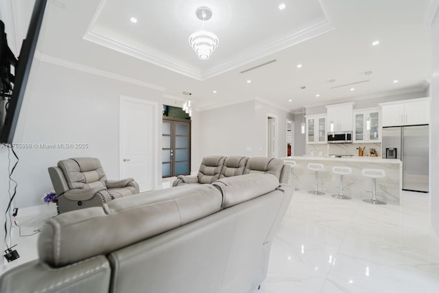 398 35th Ave NW, Naples, FL 34120 - living area with marble finish floor, crown molding, and a raised ceiling