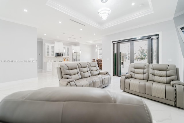 398 35th Ave NW, Naples, FL 34120 - living area featuring marble finish floor, a raised ceiling, crown molding, and recessed lighting