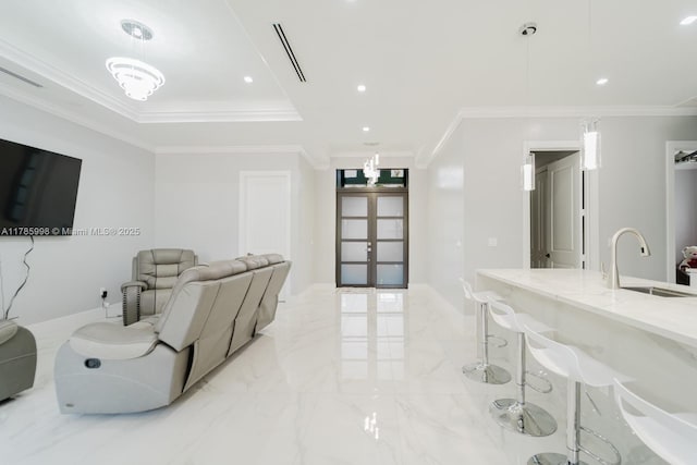 398 35th Ave NW, Naples, FL 34120 - living area featuring french doors, marble finish floor, ornamental molding, and a tray ceiling