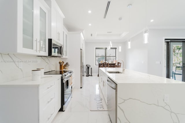 398 35th Ave NW, Naples, FL 34120 - kitchen with a sink, white cabinetry, marble finish floor, appliances with stainless steel finishes, and ornamental molding