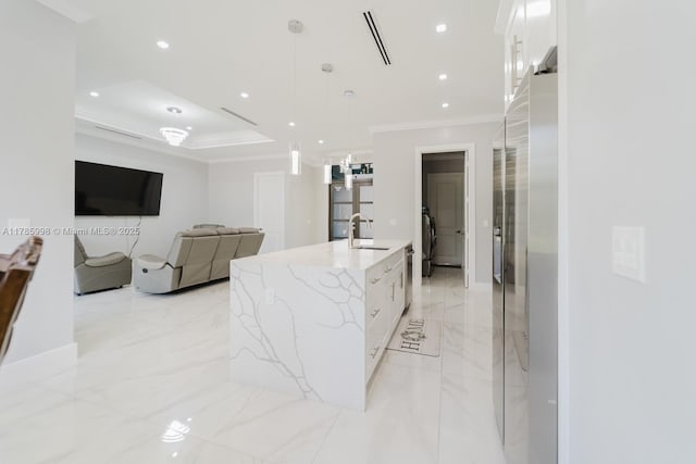 398 35th Ave NW, Naples, FL 34120 - kitchen featuring white cabinets, marble finish floor, a sink, a spacious island, and crown molding