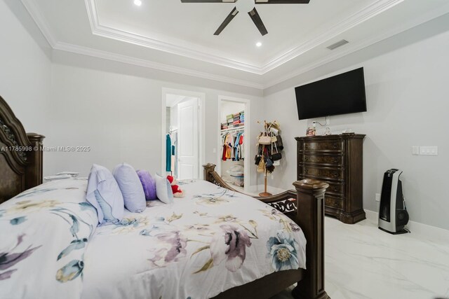 398 35th Ave NW, Naples, FL 34120 - bedroom with a raised ceiling, visible vents, a ceiling fan, ornamental molding, and a walk in closet