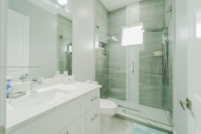 398 35th Ave NW, Naples, FL 34120 - bathroom featuring a shower stall, marble finish floor, toilet, and vanity