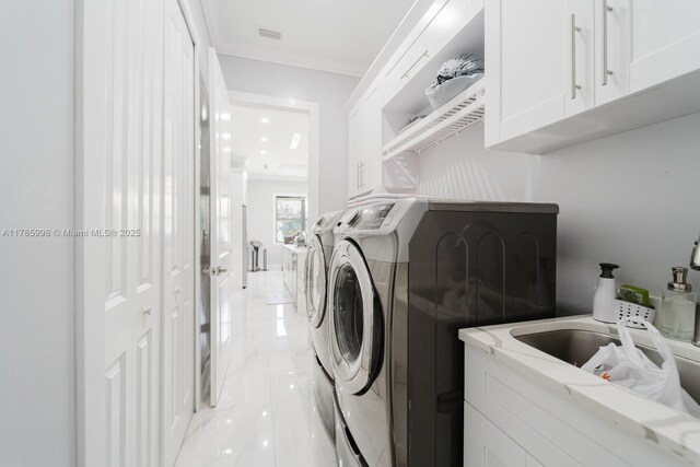 398 35th Ave NW, Naples, FL 34120 - clothes washing area with visible vents, independent washer and dryer, marble finish floor, and cabinet space