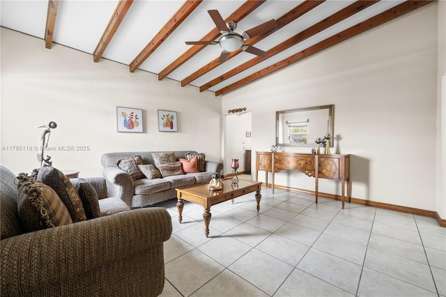 living area with ceiling fan, baseboards, light tile patterned flooring, and vaulted ceiling with beams