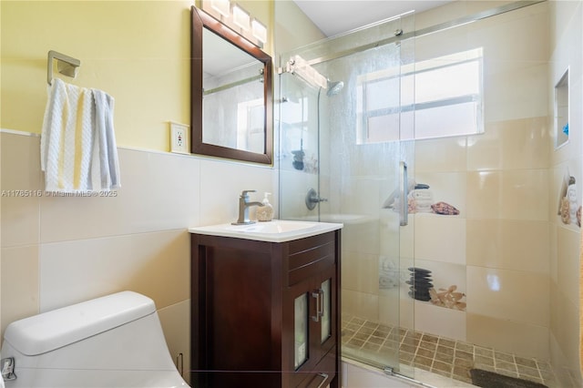full bath featuring vanity, a shower stall, and toilet