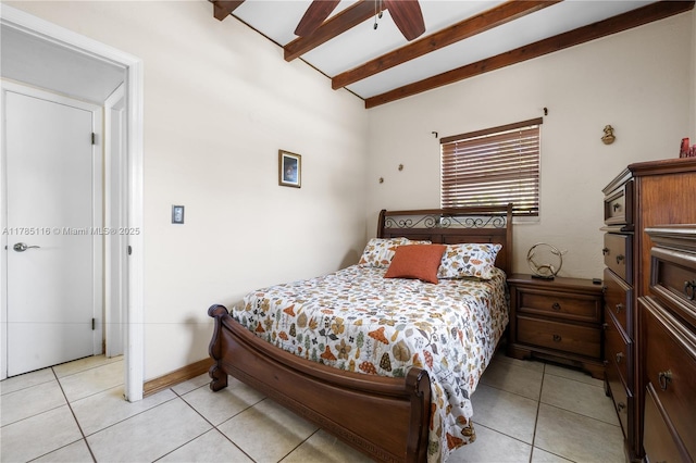 bedroom featuring lofted ceiling with beams, ceiling fan, and light tile patterned floors