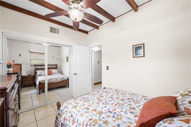 bedroom with a ceiling fan, visible vents, and light tile patterned floors