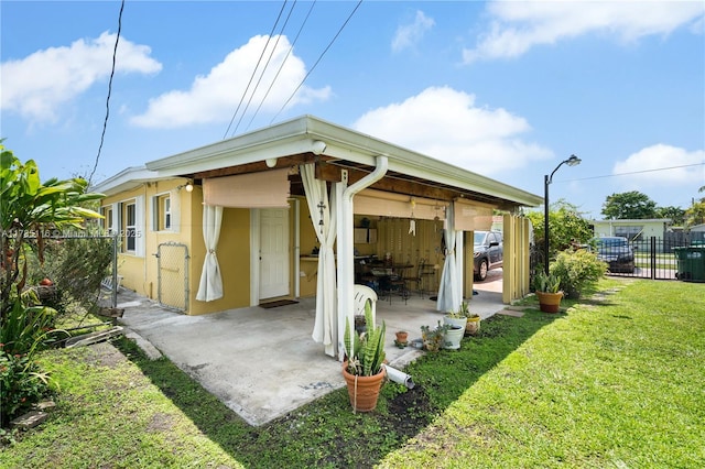 exterior space with fence and an attached carport