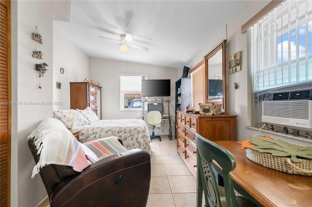 bedroom with vaulted ceiling, cooling unit, ceiling fan, and light tile patterned floors