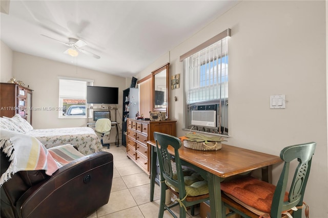 bedroom with lofted ceiling, light tile patterned flooring, multiple windows, and cooling unit