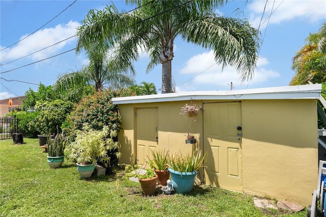 view of shed featuring fence