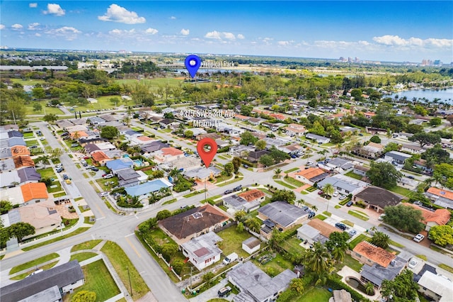 drone / aerial view with a residential view and a water view