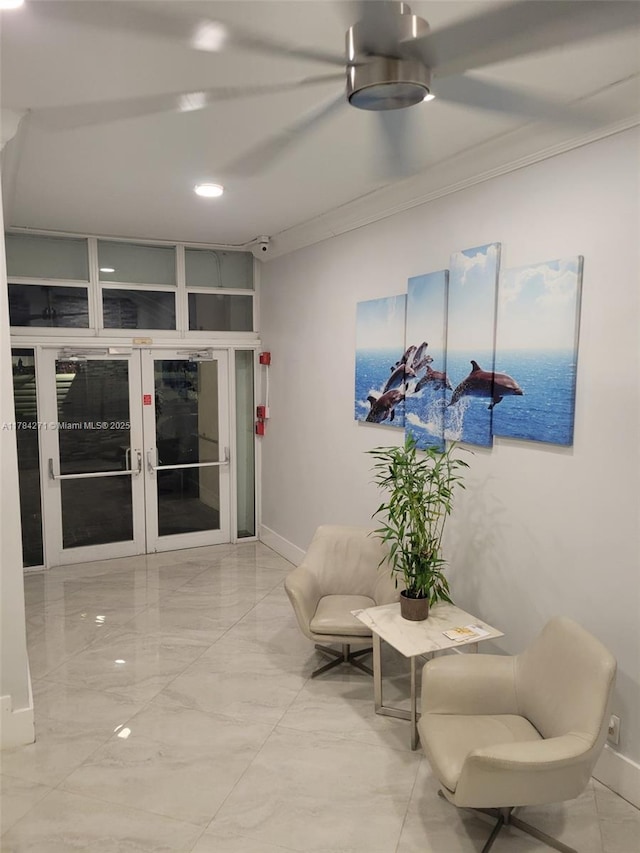 2900 Banyan St Unit 303, Fort Lauderdale, FL 33316 - sitting room with crown molding, french doors, and light marble finish floors
