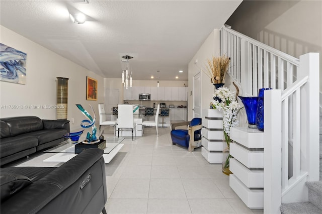 8292 NW 43rd St, Doral, FL 33166 - living room with light tile patterned flooring, stairway, and recessed lighting