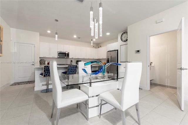 8292 NW 43rd St, Doral, FL 33166 - dining space featuring light tile patterned flooring and recessed lighting