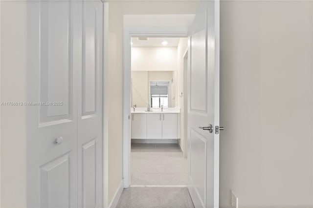 8292 NW 43rd St, Doral, FL 33166 - hall featuring light tile patterned flooring and baseboards