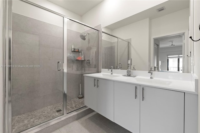 8292 NW 43rd St, Doral, FL 33166 - bathroom with double vanity, a stall shower, and tile patterned flooring