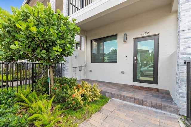 8292 NW 43rd St, Doral, FL 33166 - entrance to property featuring stucco siding and a balcony