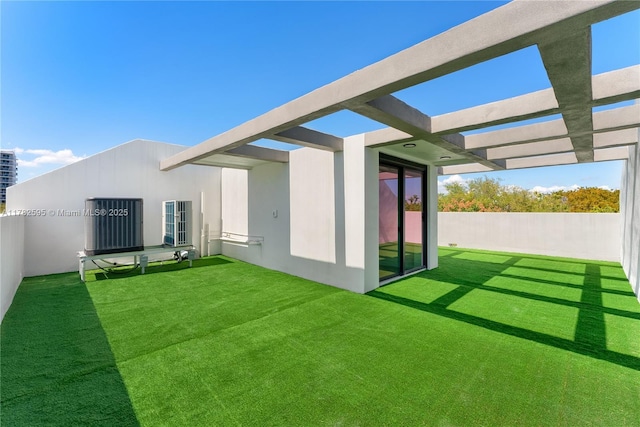 2501 SW 27th St Unit 6, Miami, FL 33133 - rear view of property featuring stucco siding, a pergola, and a yard