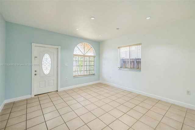 entrance foyer with recessed lighting and baseboards