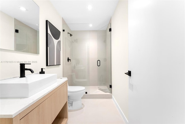 full bath with vanity, recessed lighting, a shower stall, and toilet