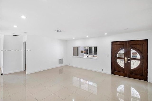 entryway featuring recessed lighting, visible vents, light tile patterned flooring, and french doors