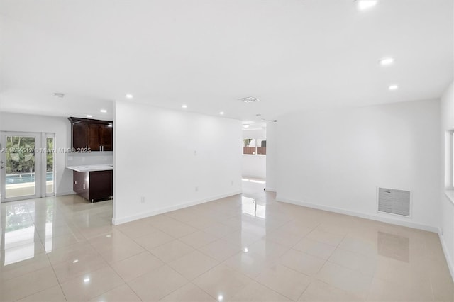 interior space featuring visible vents, recessed lighting, and light tile patterned floors