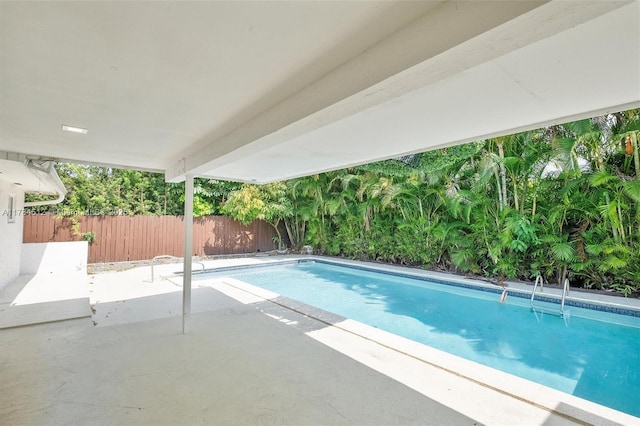 view of pool with a patio area, a fenced in pool, and a fenced backyard