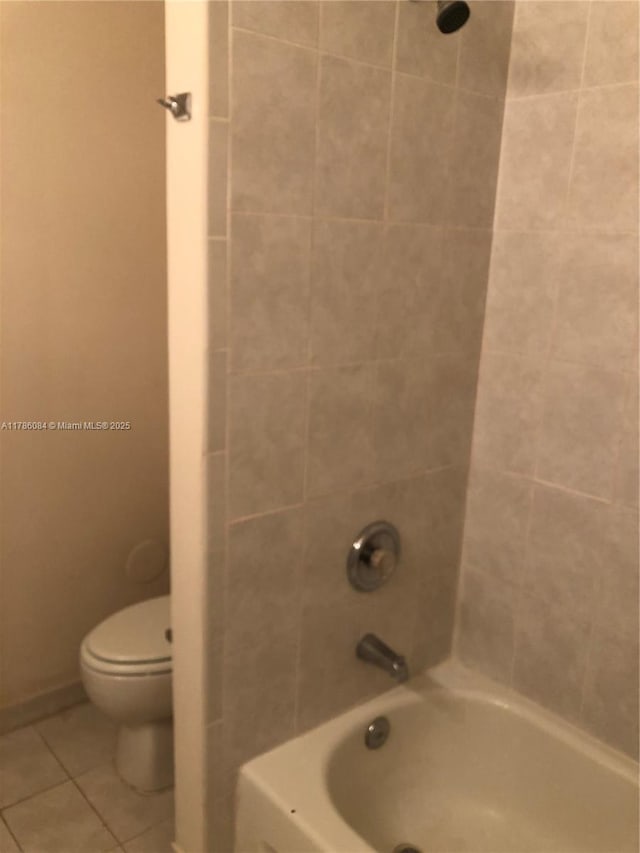 full bathroom with tile patterned flooring, shower / tub combination, and toilet