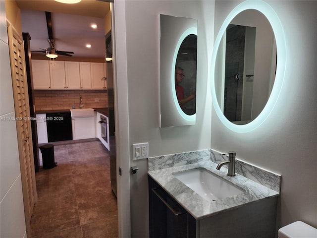 bathroom featuring decorative backsplash, vanity, recessed lighting, and ceiling fan