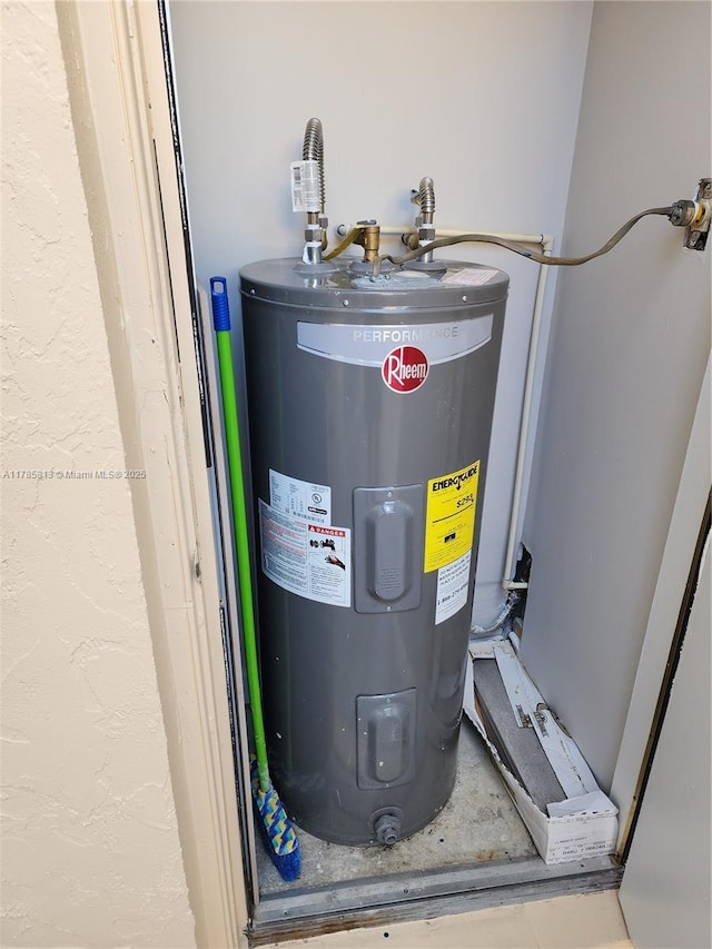 utility room featuring electric water heater