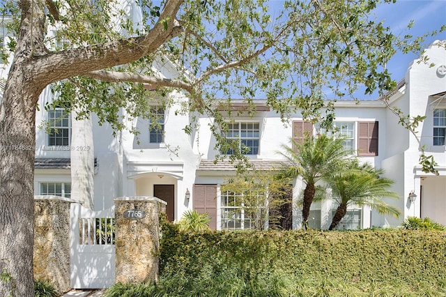 7765 SW 54th Ct Unit 7765, Miami, FL 33143 - view of front of property with stucco siding and a gate
