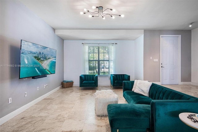 7765 SW 54th Ct Unit 7765, Miami, FL 33143 - living area with baseboards and a notable chandelier