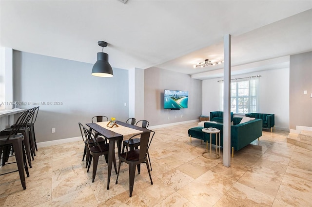 7765 SW 54th Ct Unit 7765, Miami, FL 33143 - dining room featuring stone finish floor and baseboards