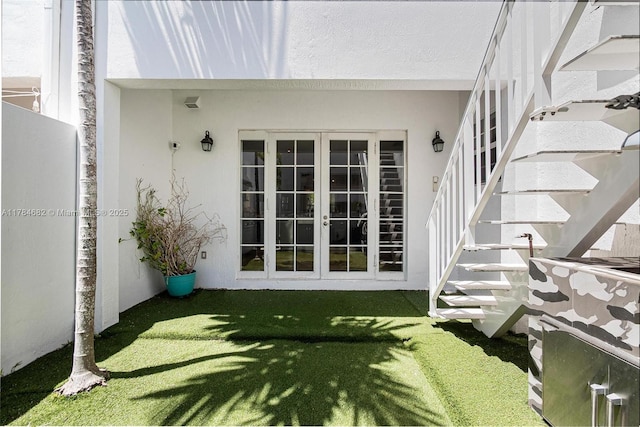 7765 SW 54th Ct Unit 7765, Miami, FL 33143 - doorway to property with french doors and stucco siding
