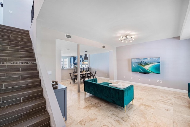 7765 SW 54th Ct Unit 7765, Miami, FL 33143 - living area with baseboards, visible vents, a chandelier, and stairway