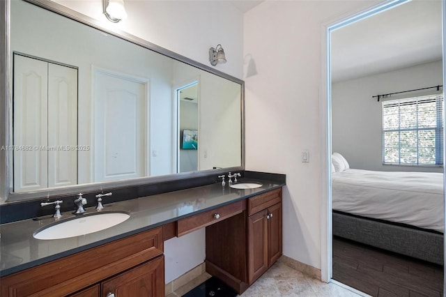 7765 SW 54th Ct Unit 7765, Miami, FL 33143 - ensuite bathroom with double vanity, baseboards, ensuite bathroom, and a sink