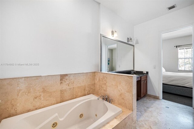 7765 SW 54th Ct Unit 7765, Miami, FL 33143 - ensuite bathroom with ensuite bath, a whirlpool tub, visible vents, and vanity
